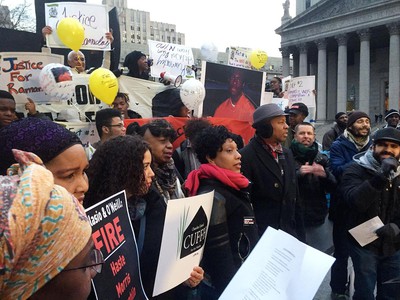 Constance Malcolm (c., in pink scarf) is flanked by Gwen Carr (4th from l.), mother of Eric Garner, and Councilman Andy King during a rally at Foley Square on Thursday, the five-year anniversary of the death of her son, Ramarley Graham. (JOHN ANNESE/NEW YORK DAILY NEWS )